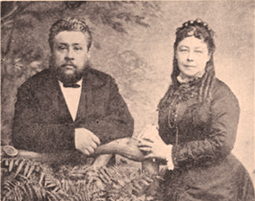A scratchy sepia tone picture of Charles Spurgeon and his wife, Susannah sitting in chairs.
